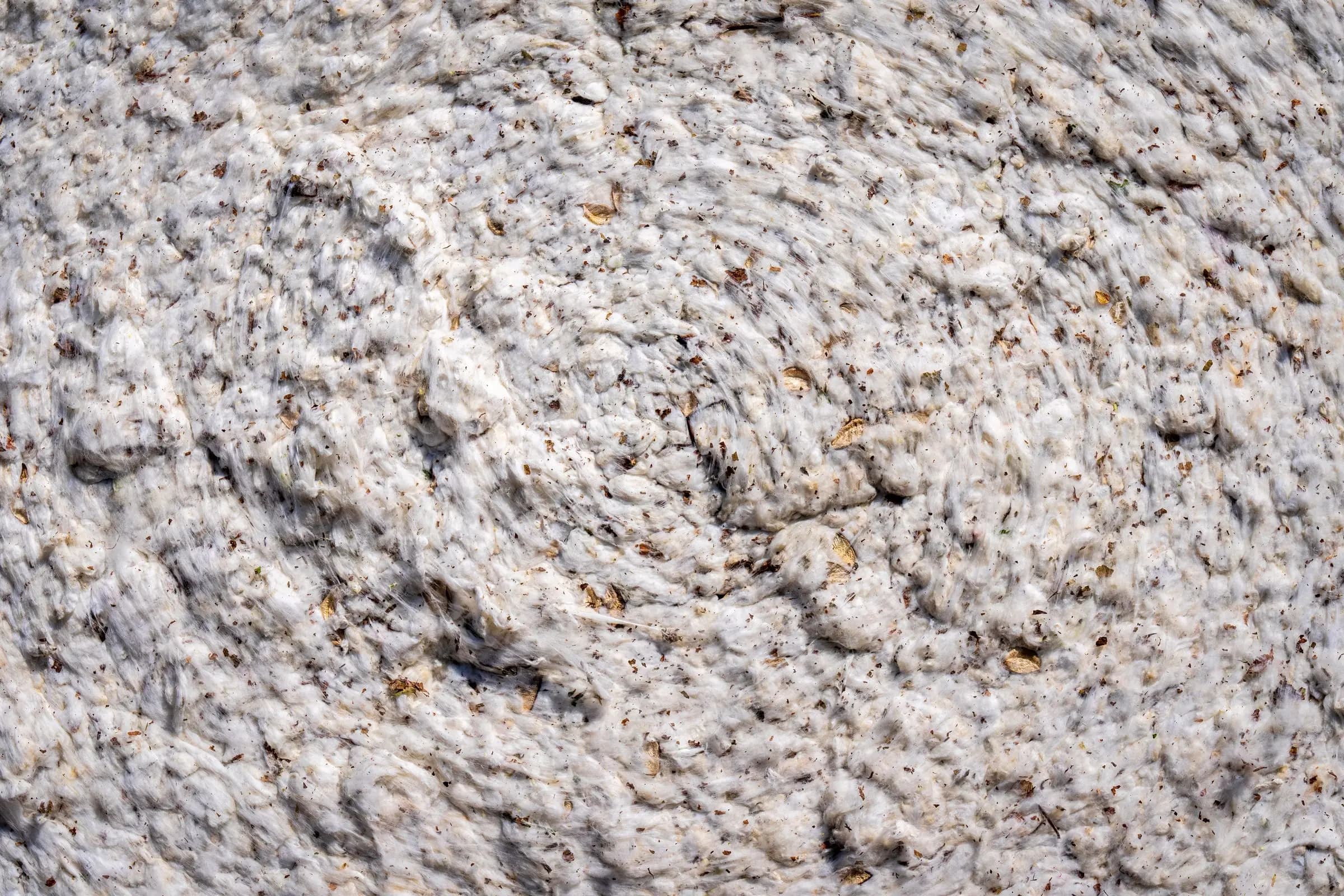 Close-up of compressed off-white cotton fibre material