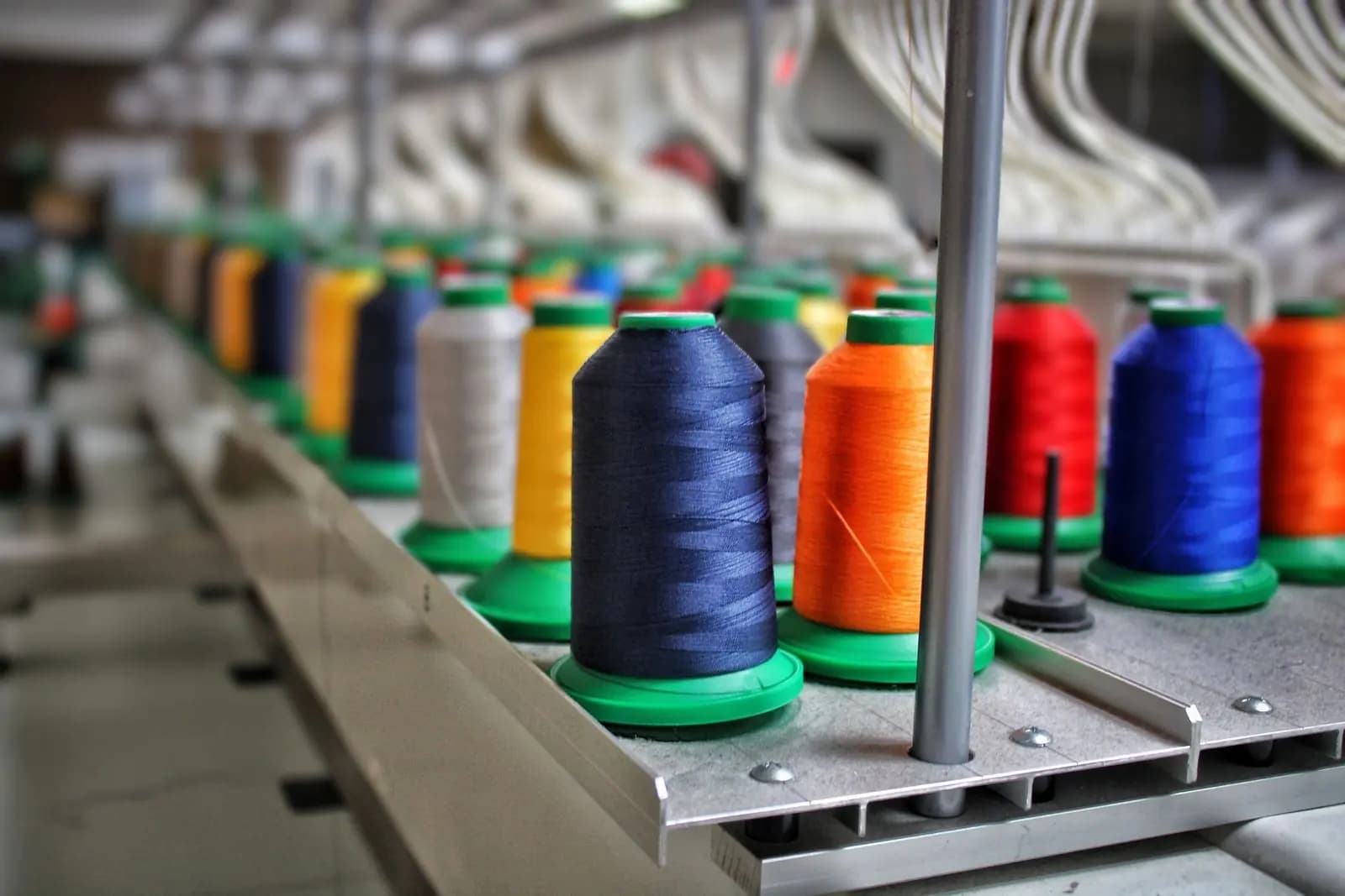 Thread spools on machinery in a textile production facility